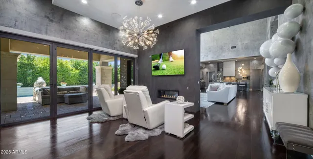 a spacious bedroom with a large bed and a large window