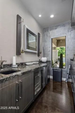 a spacious bedroom with a bed and a view of bathroom