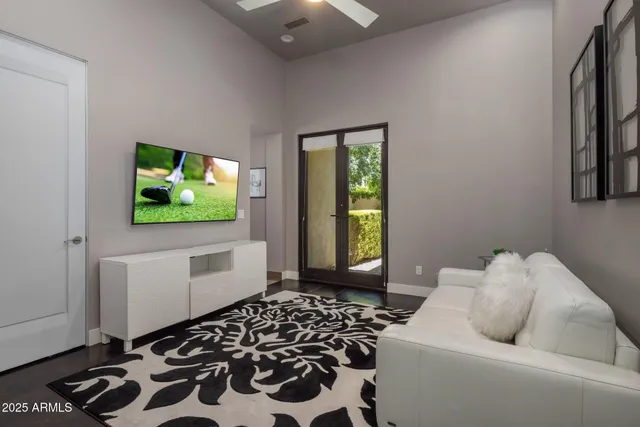 a bedroom with a large bed and a large window