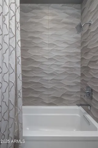 a room with pool table and glass windows