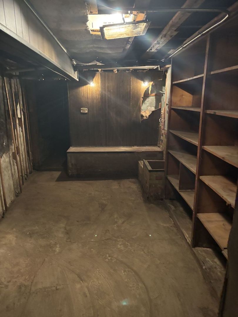 2469 East 74th Street Chicago, IL 60649 - Photo 14 of 24 a view of an empty room with a staircase