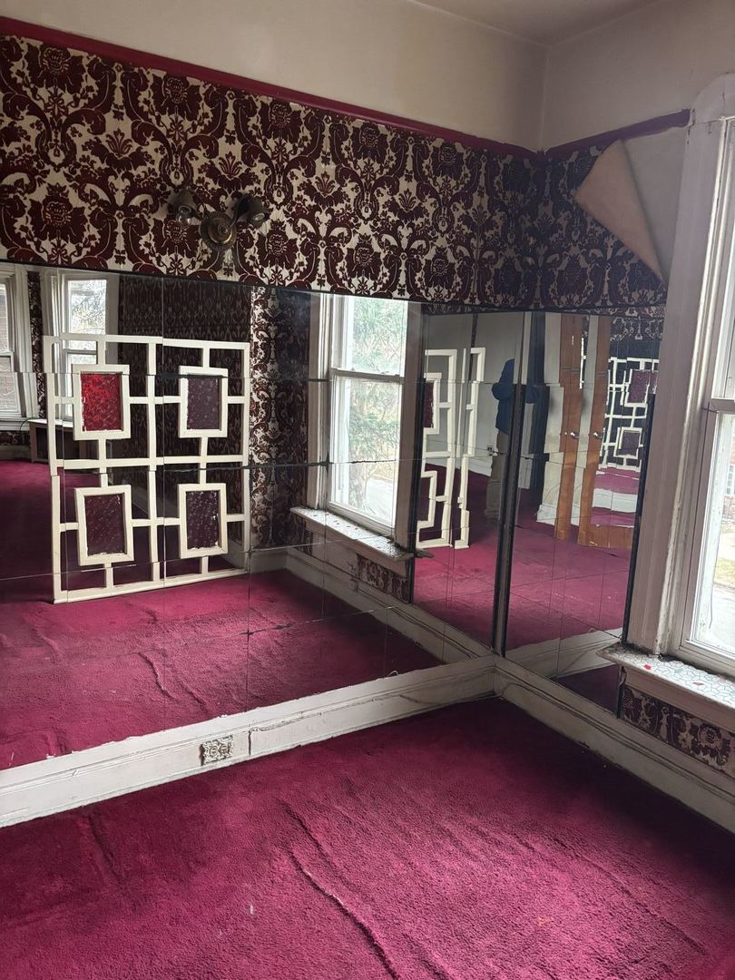 2469 East 74th Street Chicago, IL 60649 - Photo 2 of 24 a view of an empty room with windows