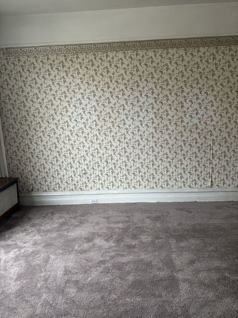 2469 East 74th Street Chicago, IL 60649 - Photo 23 of 24 a view of a black gate