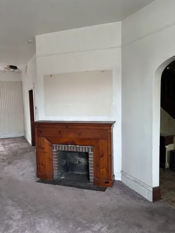 a living room with a fireplace