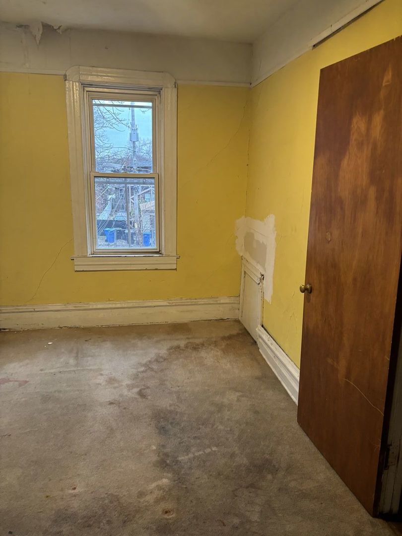 2469 East 74th Street Chicago, IL 60649 - Photo 9 of 24 a view of a room with window