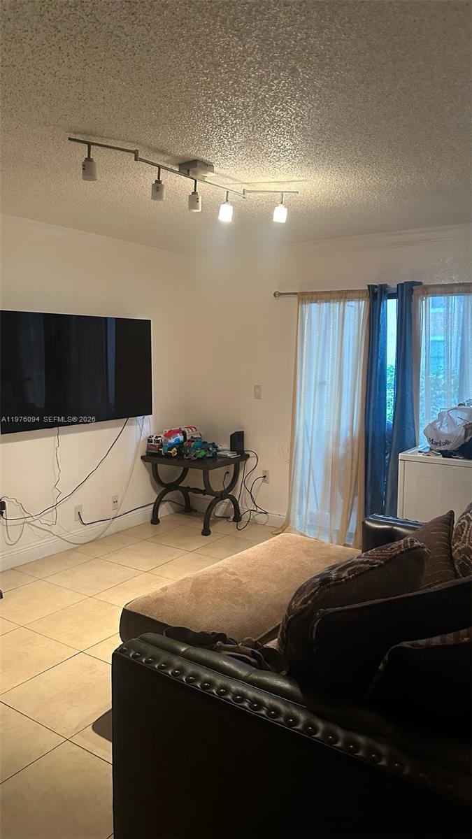 15640 Southwest 106th Lane, Unit 903 Miami, FL 33196 - Photo 3 of 8 a bedroom with bed and window