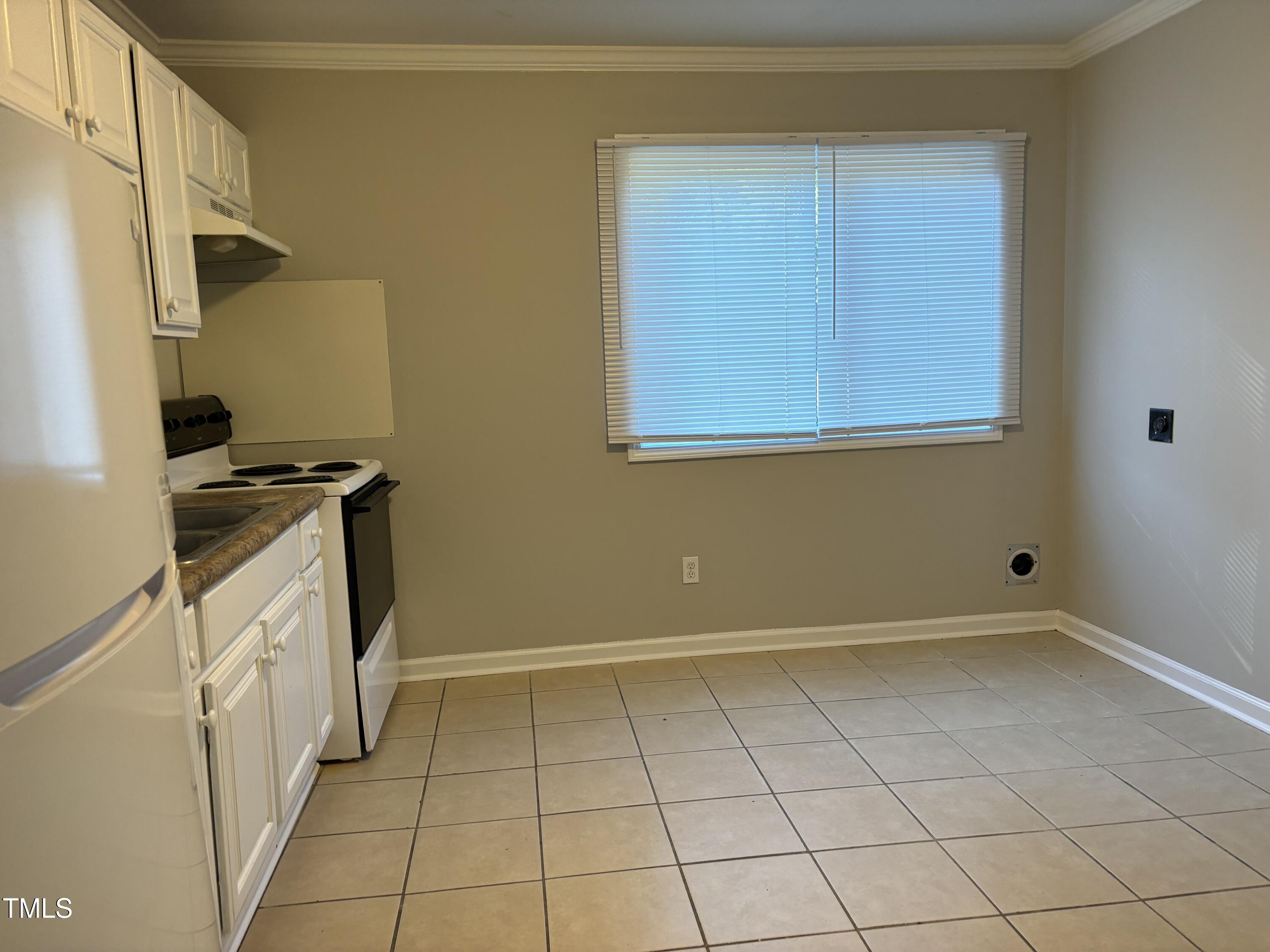 564 Dacian Road Raleigh, NC 27610 - Photo 12 of 16 a view of a kitchen with white cabinets
