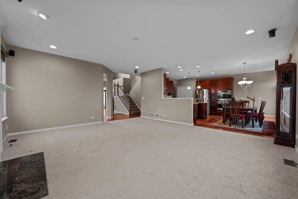 312 Monument Road Elgin, IL 60124 - Photo 16 of 44 a view of a room with furniture and a gym equipment