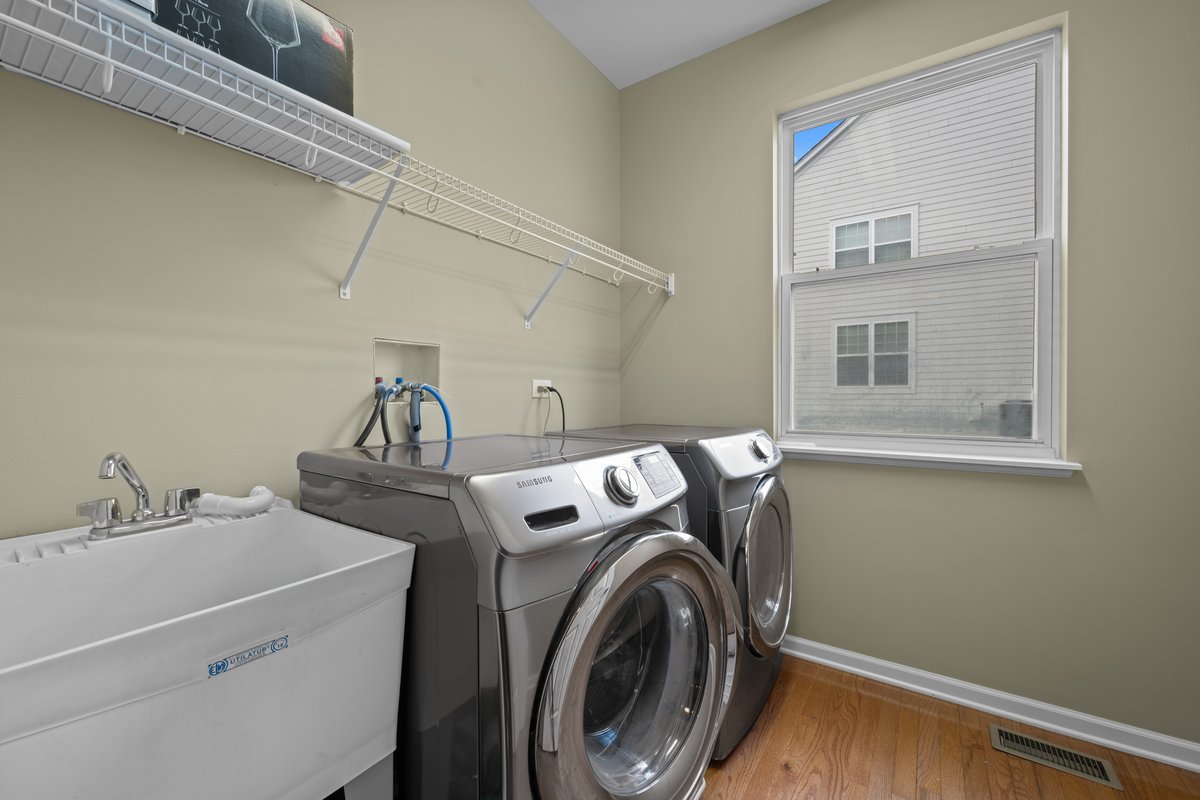312 Monument Road Elgin, IL 60124 - Photo 17 of 44 a utility room with dryer and washer