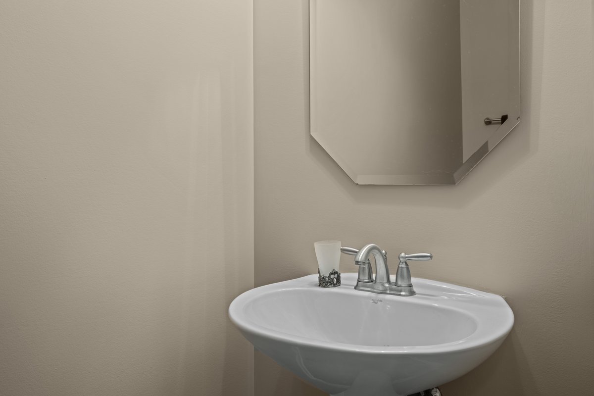 312 Monument Road Elgin, IL 60124 - Photo 18 of 44 a bathroom with a sink and a mirror