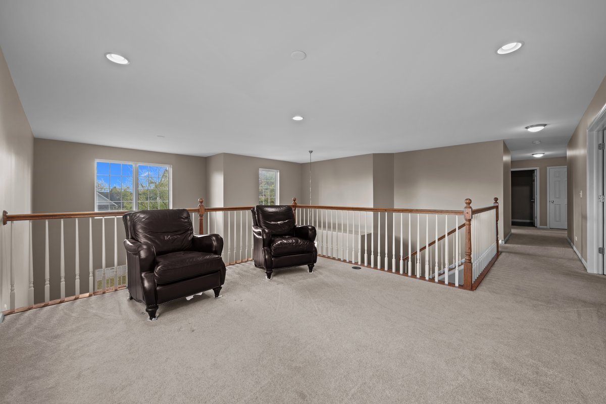 312 Monument Road Elgin, IL 60124 - Photo 19 of 44 a living room with furniture and a ceiling fan
