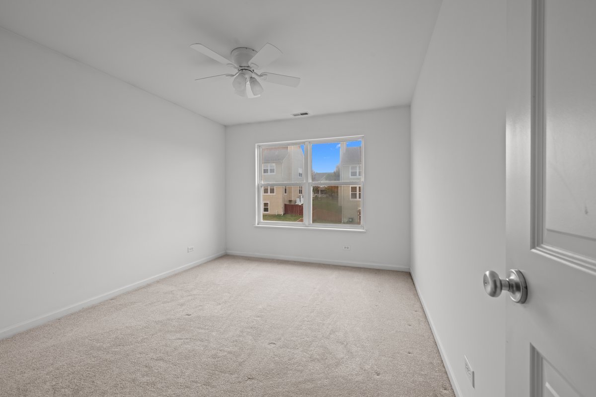 312 Monument Road Elgin, IL 60124 - Photo 26 of 44 a view of an empty room with a window