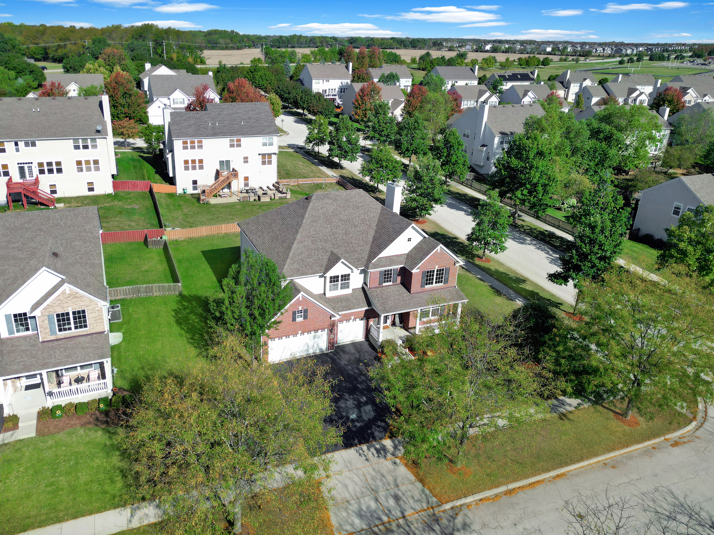 312 Monument Road Elgin, IL 60124 - Photo 34 of 44 an aerial view of a house with a yard