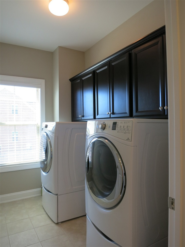 3916 Rock Rose Lane Raleigh, NC 27612 - Photo 13 of 25 Nearby is the Laundry Rm w/tile flr & wall cabinets. Laundry