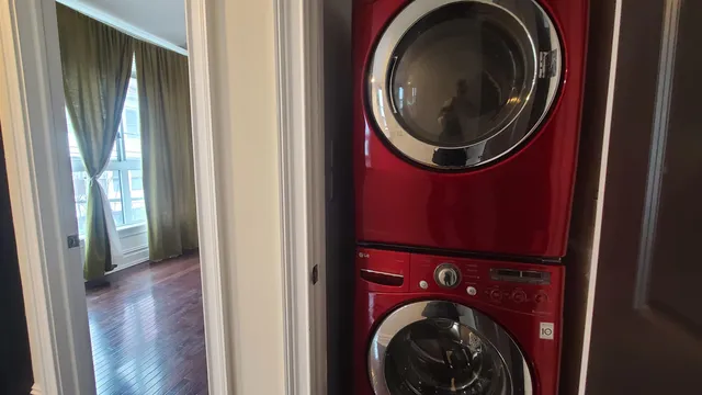 a view of a hallway with washer and dryer