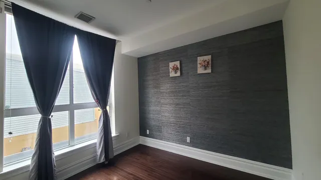 a view of entryway with wooden floor and door