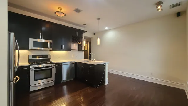 a kitchen with a stove and a microwave
