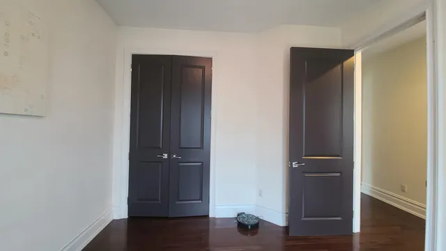 an empty room with wooden floor