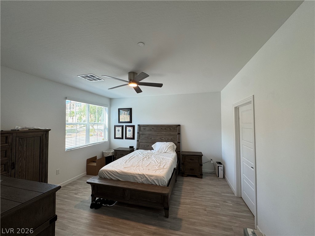 2555 Hampton Road, Unit 4205 Henderson, NV 89052 - Photo 33 of 52 This airy bedroom offers comfortable living with elegant flooring and a calming ambiance.