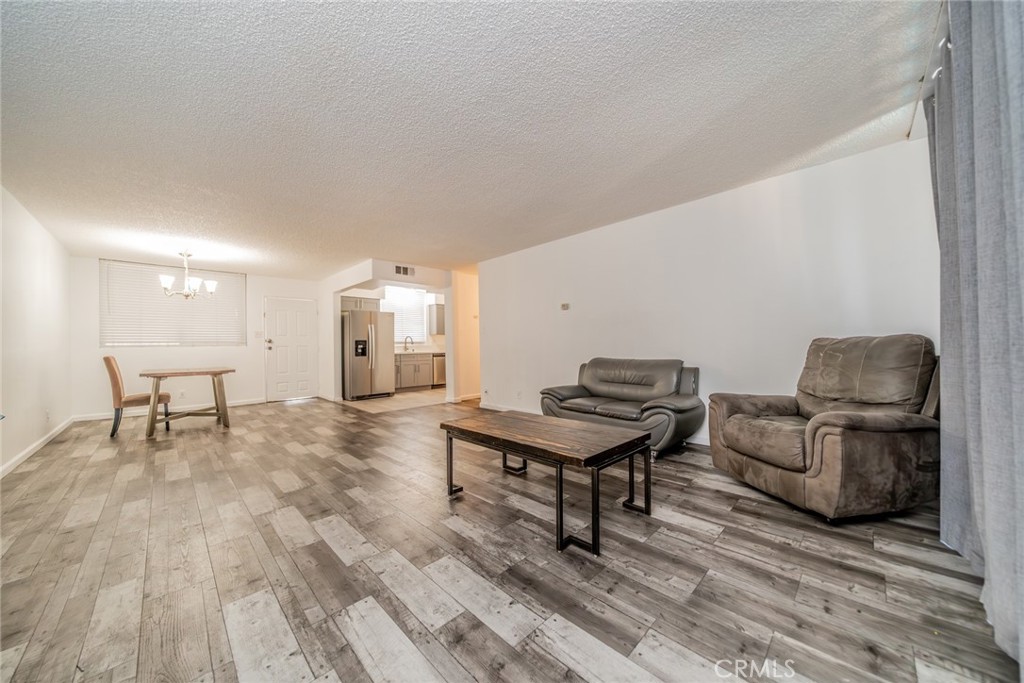 6979 Palm Court, Unit 319F Riverside, CA 92506 - Photo 12 of 44 a living room with furniture and a table