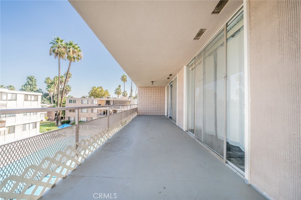 6979 Palm Court, Unit 319F Riverside, CA 92506 - Photo 18 of 44 a view of a hallway with wooden floor