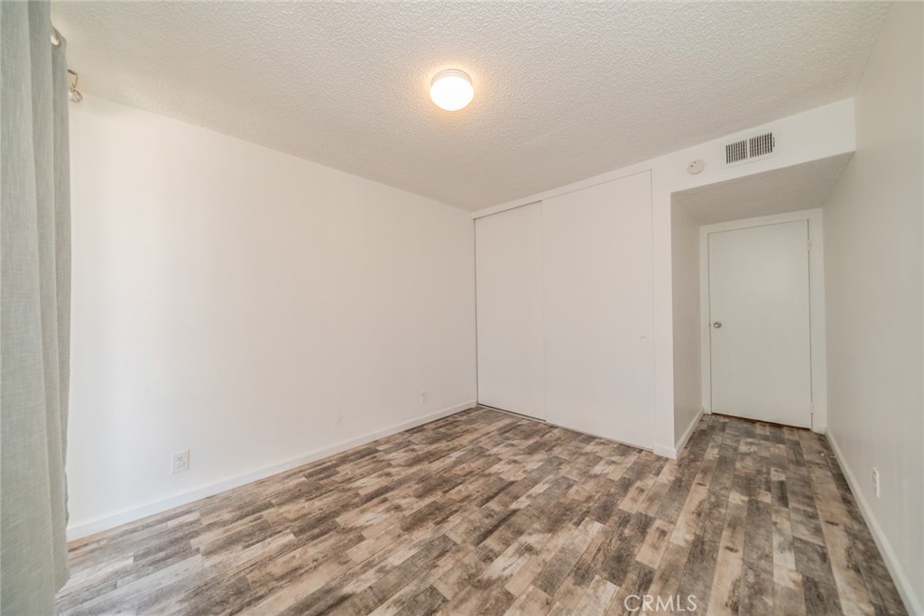 6979 Palm Court, Unit 319F Riverside, CA 92506 - Photo 22 of 44 a view of empty room
