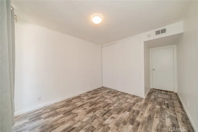 a view of a livingroom with furniture and staircase