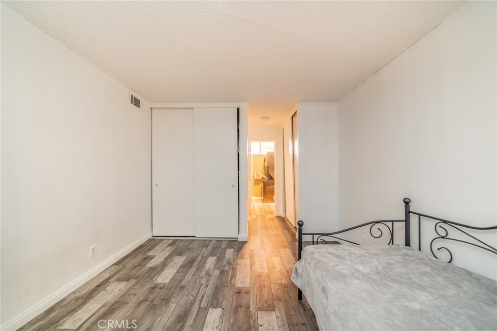 6979 Palm Court, Unit 319F Riverside, CA 92506 - Photo 26 of 44 a view of a room with wooden floor