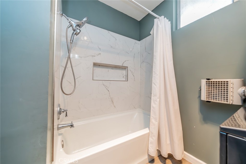 6979 Palm Court, Unit 319F Riverside, CA 92506 - Photo 27 of 44 a bathroom with a bathtub and a shower