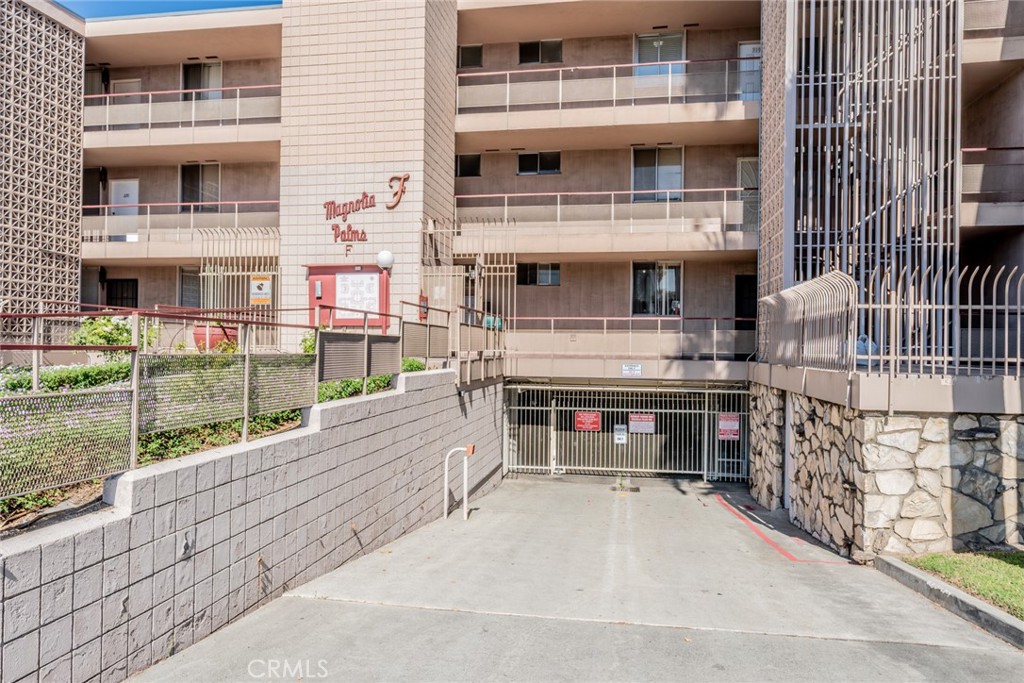 6979 Palm Court, Unit 319F Riverside, CA 92506 - Photo 3 of 44 a view of building with an outdoor space