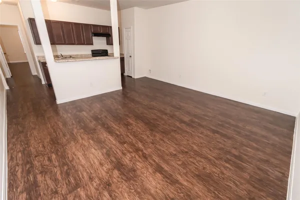 a view of storage and utility room with wooden floor