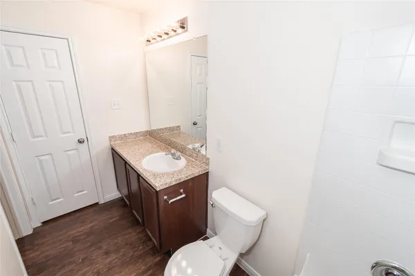 a bathroom with a sink toilet and vanity
