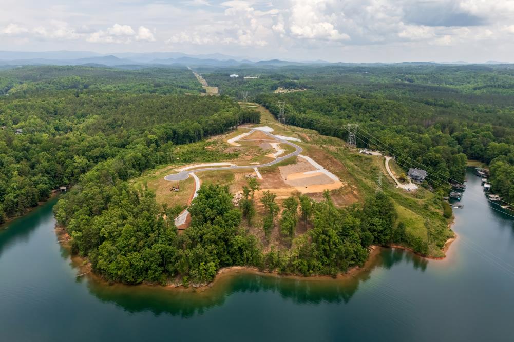 4 Warpath Ridge Trail Six Mile, SC 29682 - Photo 11 of 16 A pristine lakeside property features cleared lots, new roads, and established waterfront homes nestled in a verdant landscape.