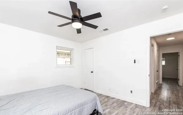 a view of a livingroom with wooden floor