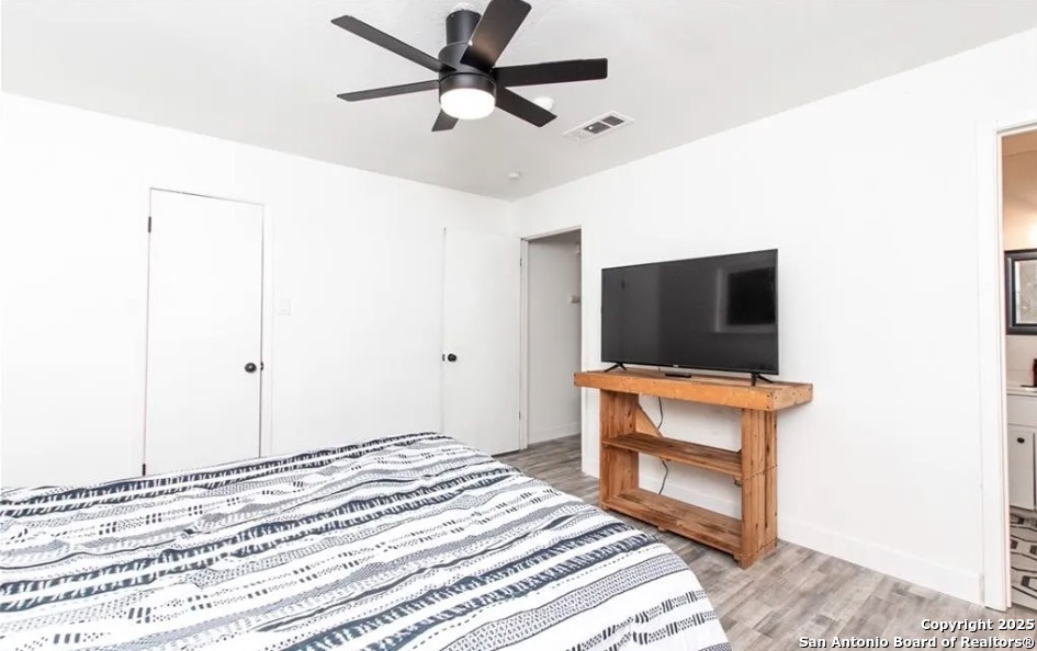 902 Concord Drive Temple, TX 76504 - Photo 21 of 24 a bedroom with a bed and a flat screen tv