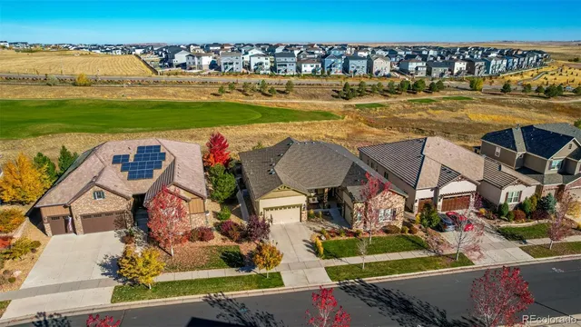 an aerial view of houses with outdoor space