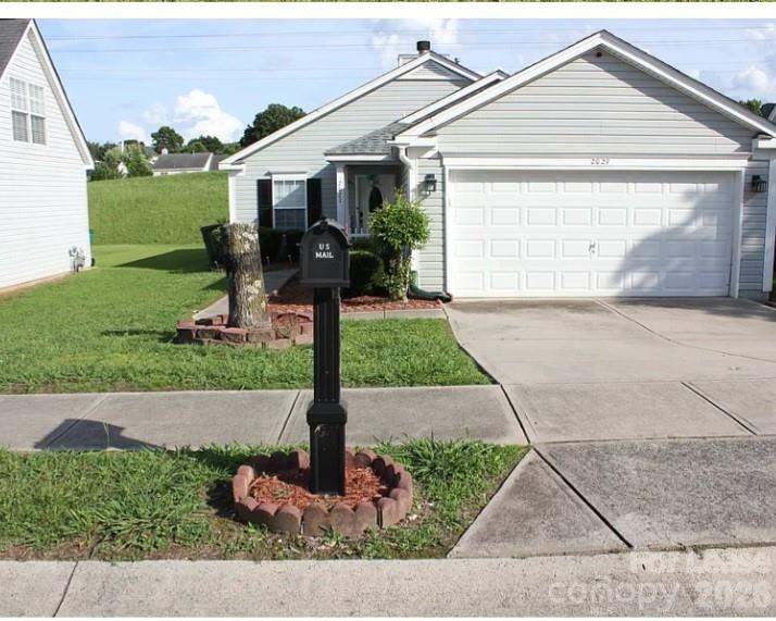 2027 Pimpernel Road Charlotte, NC 28213 - Photo 9 of 12 a front view of a house with garden