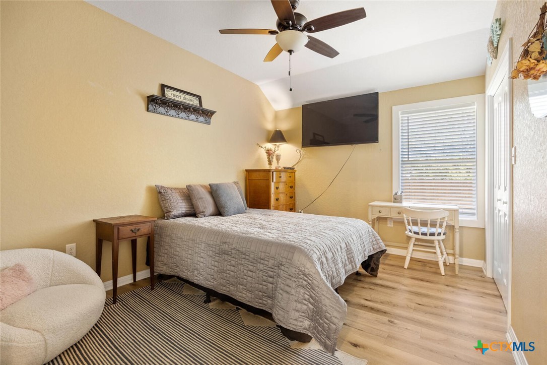 1306 Live Oak Drive Spring Branch, TX 78070 - Photo 12 of 18 a bedroom with a bed and wooden floor