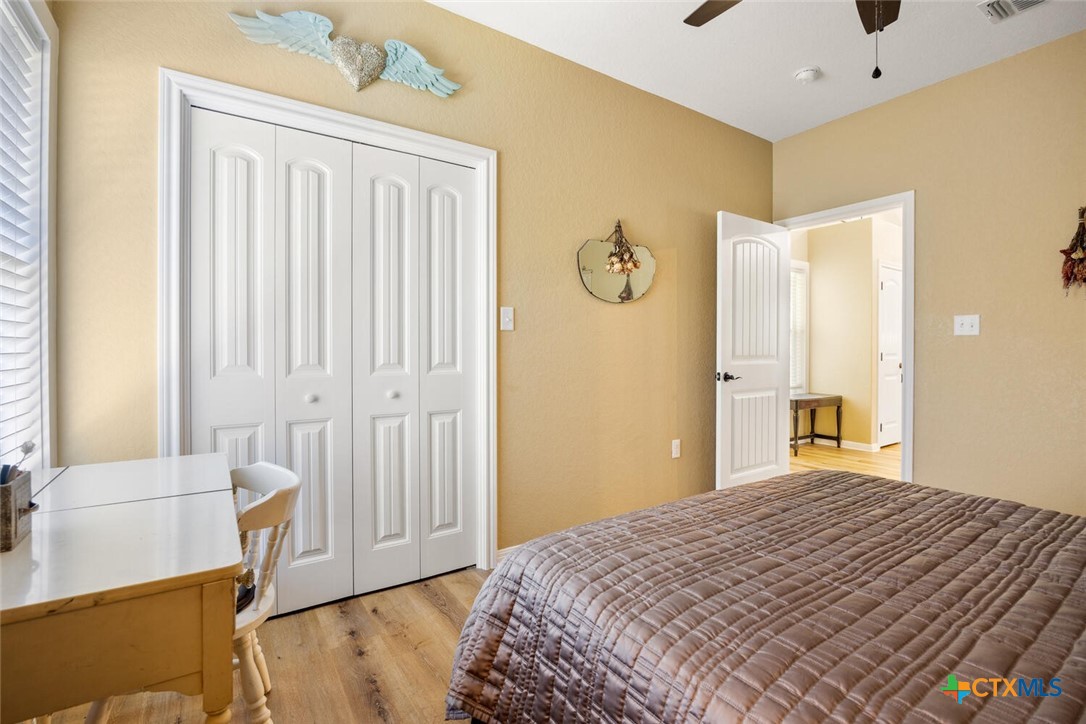 1306 Live Oak Drive Spring Branch, TX 78070 - Photo 13 of 18 a bedroom with a bed and a cabinets