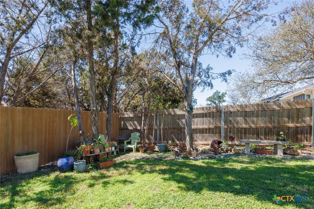 1306 Live Oak Drive Spring Branch, TX 78070 - Photo 16 of 18 a view of a chairs and tables in the backyard