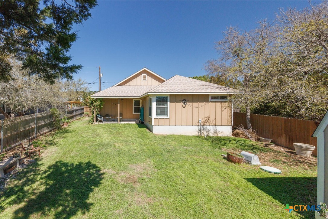 1306 Live Oak Drive Spring Branch, TX 78070 - Photo 18 of 18 a house with garden in front of it