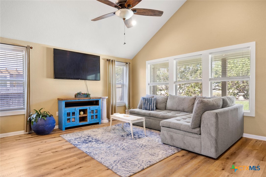 1306 Live Oak Drive Spring Branch, TX 78070 - Photo 6 of 18 a living room with furniture a flat screen tv and a fireplace