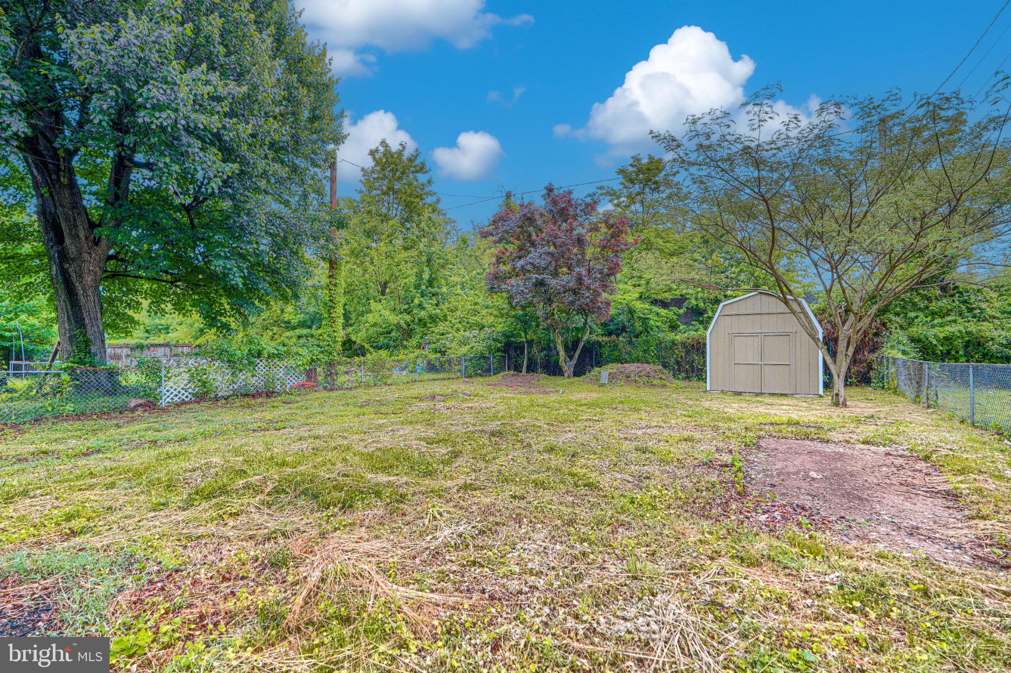 143 Rigdon Road Aberdeen, MD 21001 - Photo 57 of 57 Spacious backyard with lush greenery.