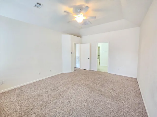 a view of a big room with carpet
