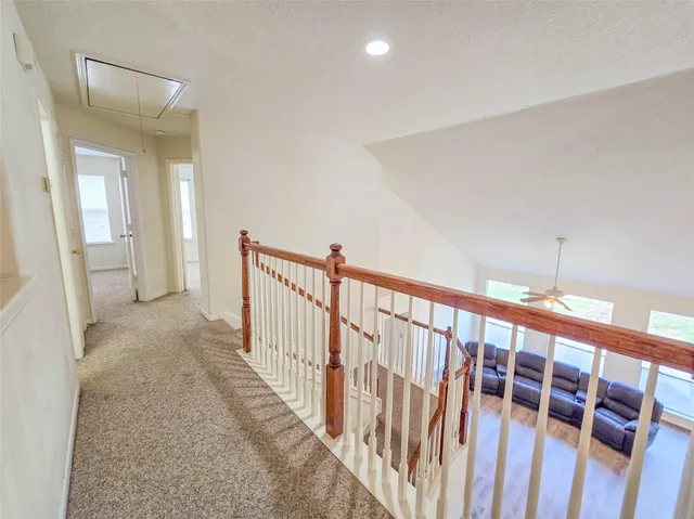 a view of hallway with stairs