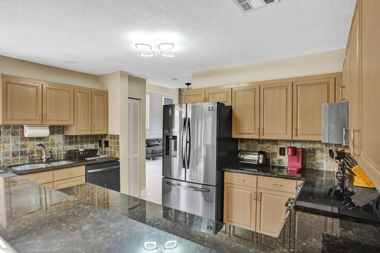 5465 Monterey Circle, Unit D Delray Beach, FL 33484 - Photo 27 of 67 Wood Cabinetry