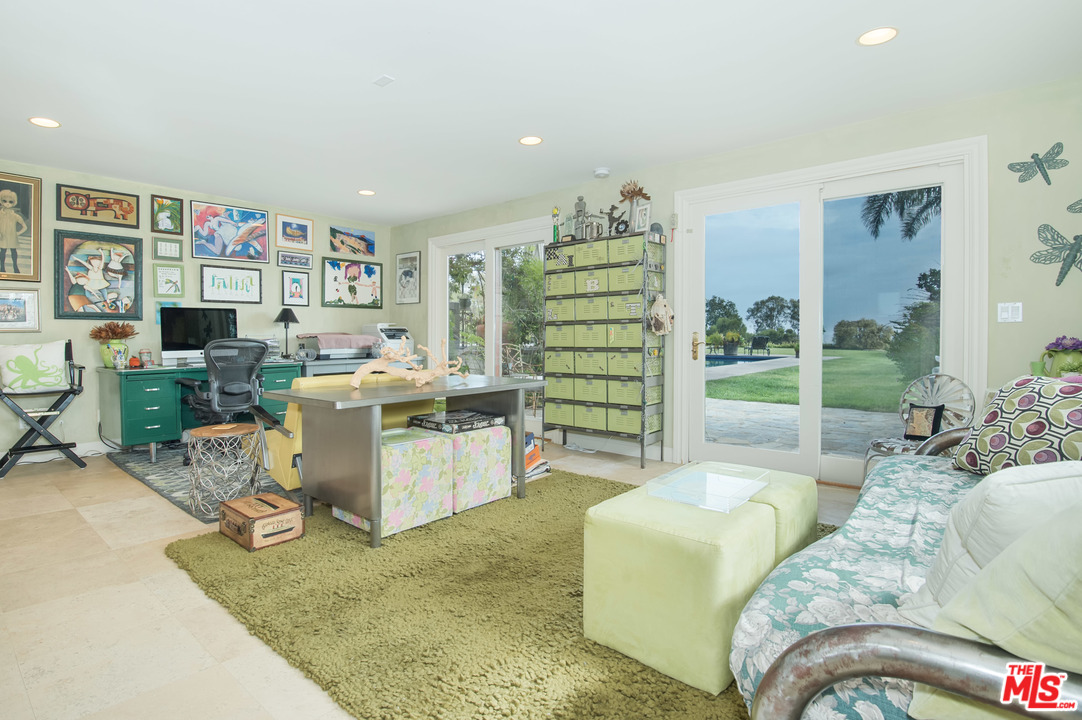 29660 Harvester Road Malibu, CA 90265 - Photo 17 of 32 a living room with furniture rug and window