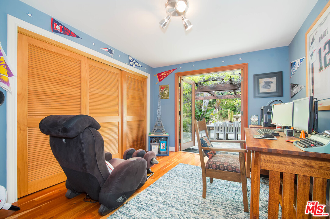 29660 Harvester Road Malibu, CA 90265 - Photo 20 of 32 a living room with furniture and a large window