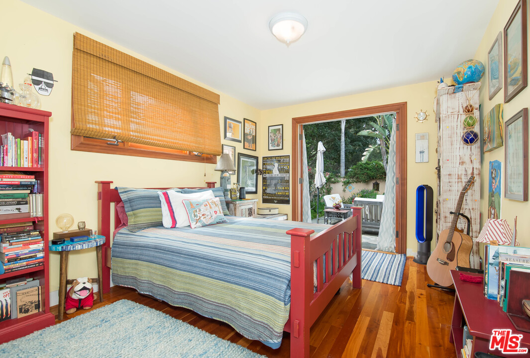 29660 Harvester Road Malibu, CA 90265 - Photo 21 of 32 a bedroom with furniture and a window