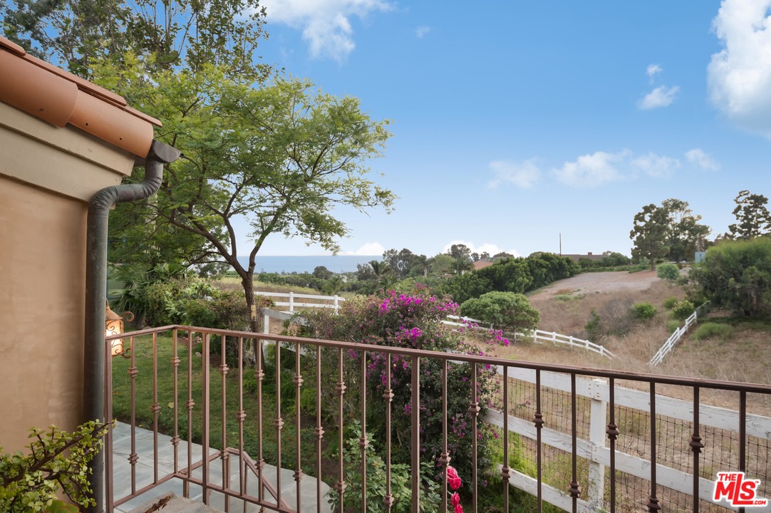 29660 Harvester Road Malibu, CA 90265 - Photo 23 of 32 a view of a balcony with wooden fence and floor